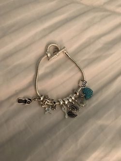 New sterling silver bracelet w charms take all for 30.00!