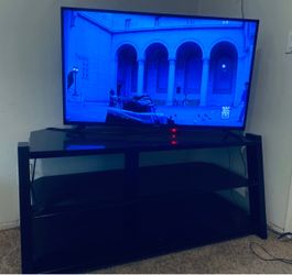 Toshiba fire TV edition 43 inch With box and Glass top entertainment center Original Owner in excellent working condition
