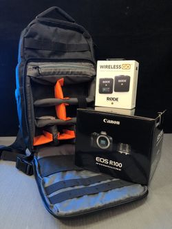 R100 Canon EOS with 18-45mm Lens, Rode wireless and padded camera bag