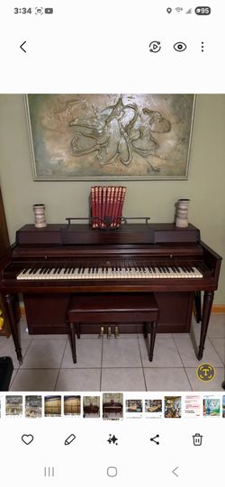 Wurlitzer Piano With Bench and music books