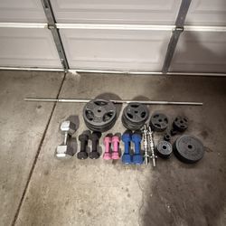250lb of 1-inch weights and a few bonus dumbbells