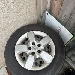 4 tires with Nissan Caps