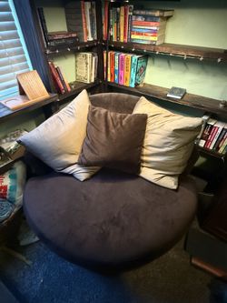Cozy brown rotating cuddle accent chair