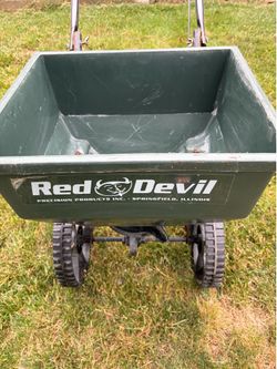 Red devil broadcast fertilizer and seed spreader