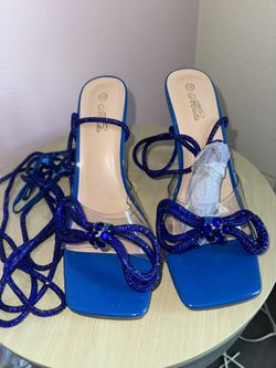 Blue strappy heels with bow