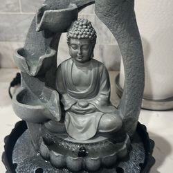 Buddha With Water Fountain And Light