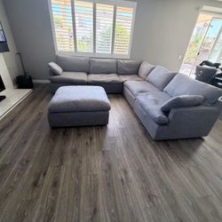 Grey sectional couch with ottoman