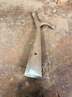 Soiled brass boat hook