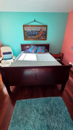 Queen size bed with mattress. Like new.
