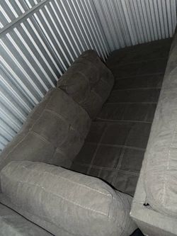 Gray L shaped sofa with ottoman