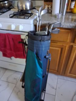 Golf bag with 3 drivers 2 putters  wedge and irons