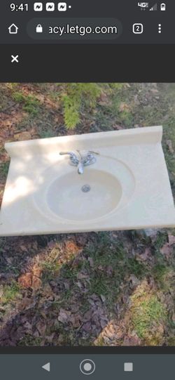 Nice sink has a moen faucet, everything works as it should the chip on the top would be covered by your trim.