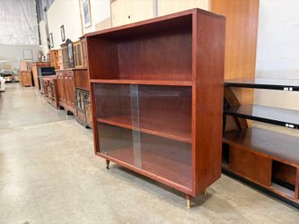 Vintage Mid-Century Modern Petite Cherry Finished Bookcase with Bronze Capped Legs