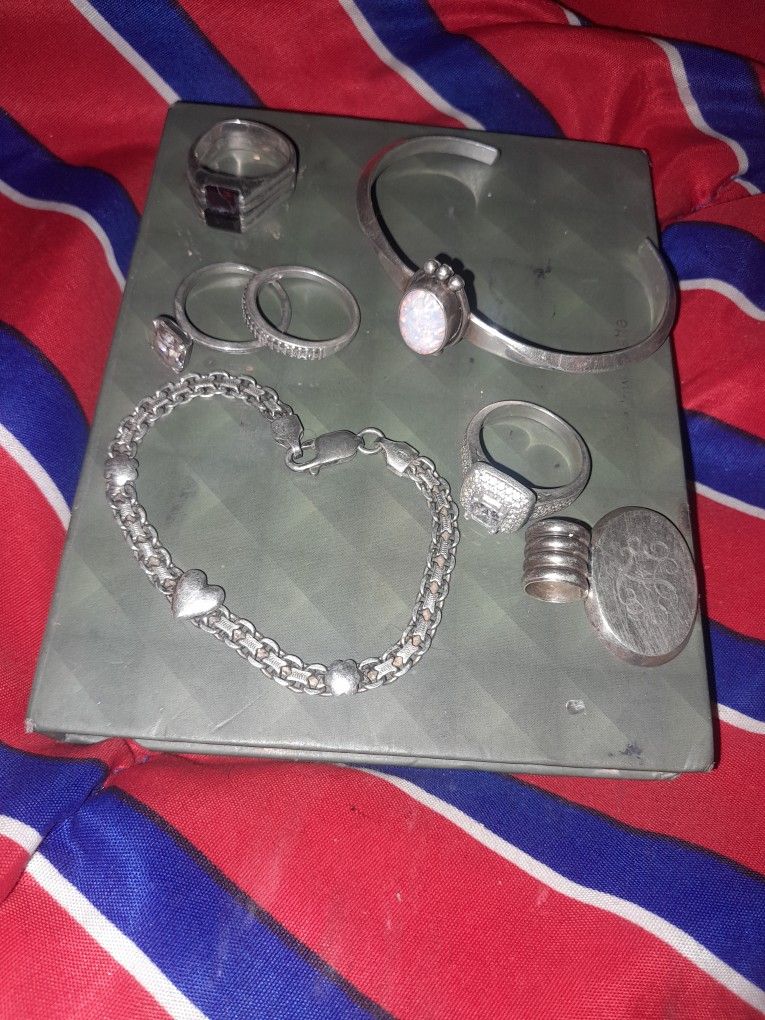 7 pieces of sterling silver. 925 one charm 2 bracelets and 4 rings