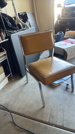 Light brown, leather, and silver chair