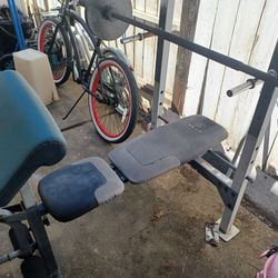Bench With  Bar And 2 25lb Weights 