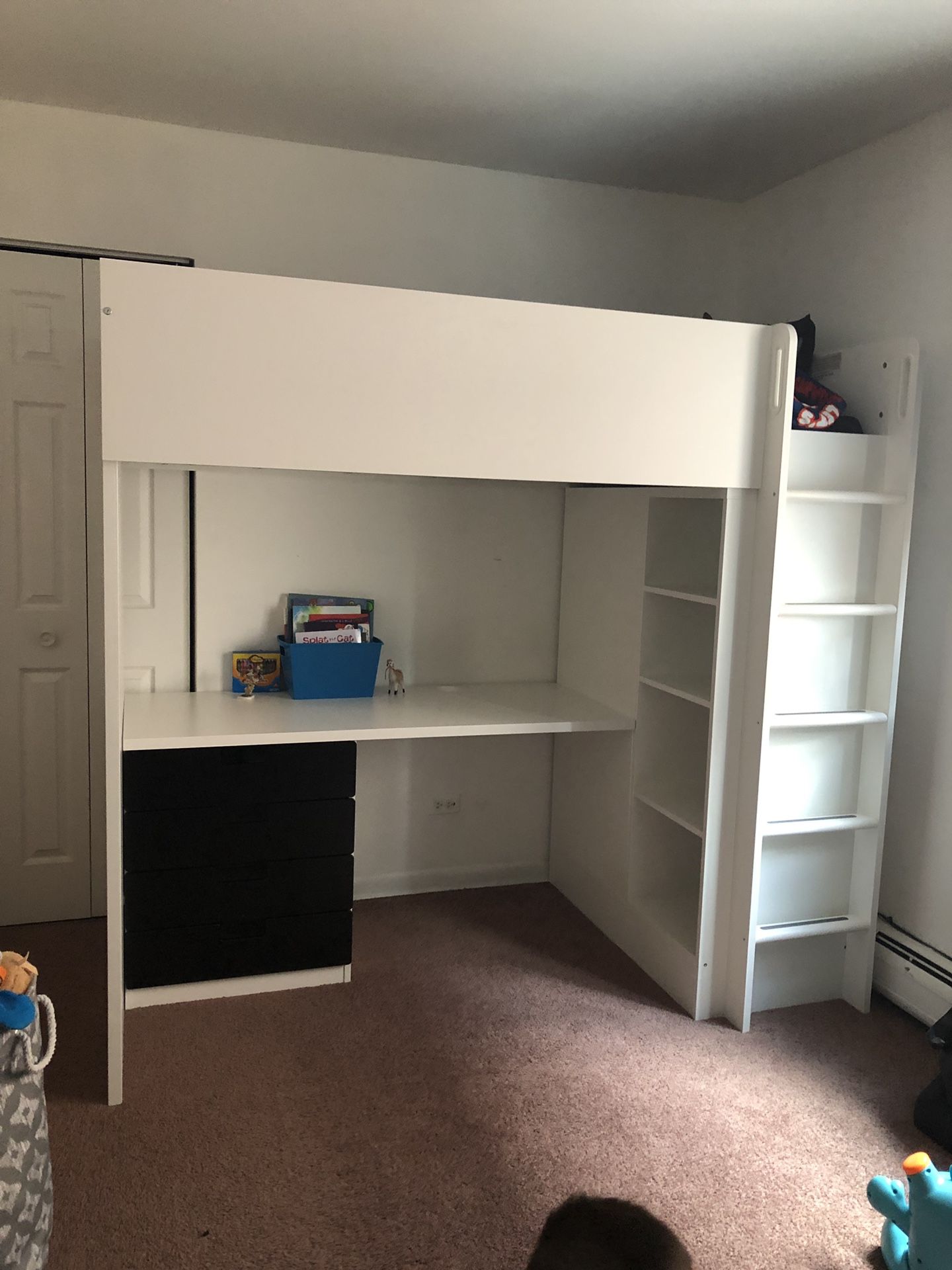 Twin bed with desk and lots of storage
