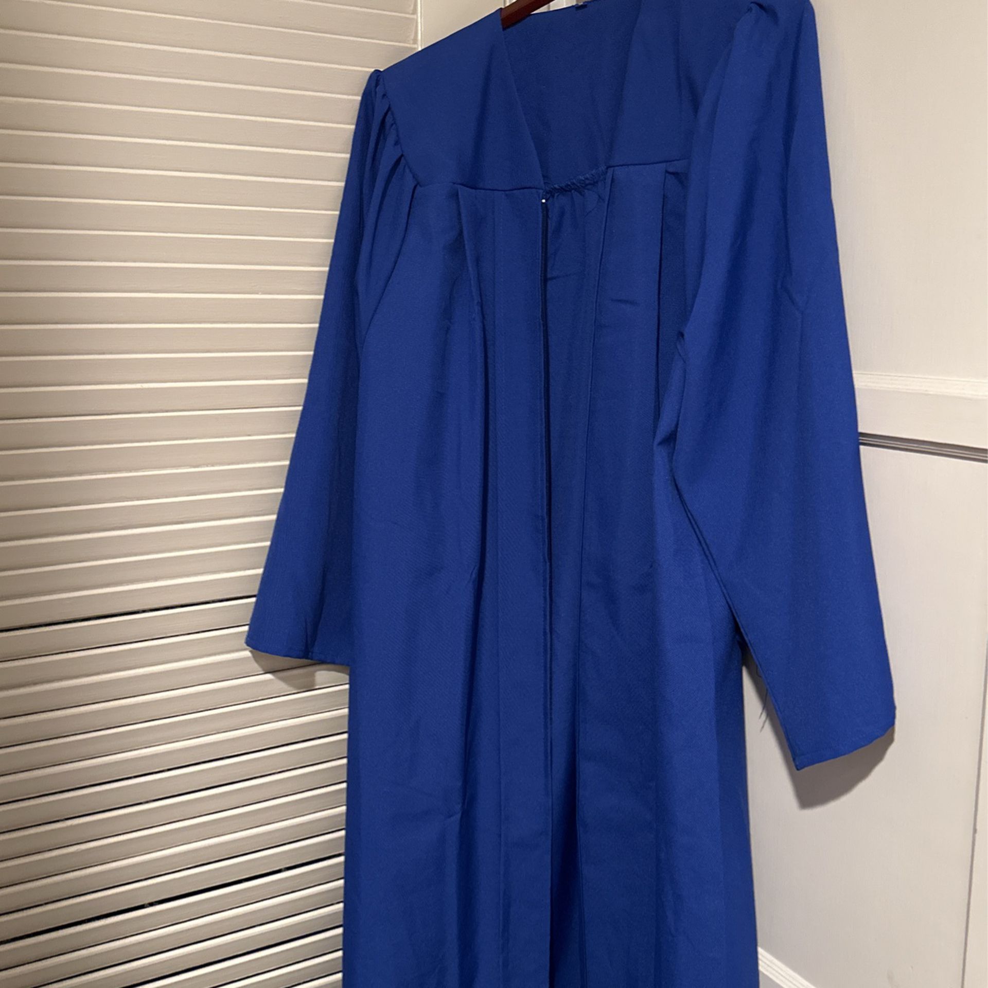 Graduation Cap And Gown. 