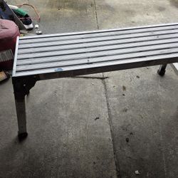 Aluminum Werner AP-20 work platform. Super handy for projects around house or garage. Has 225 lb load capacity. Platform length 39.5 inches, width 12 