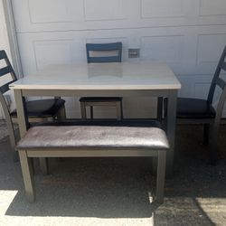 TABLE BENCH AND THREE CHAIRS. 