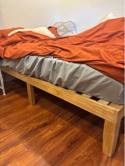 Light wood full sized bed frame