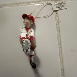 This is a Kurt S. Adler baseball player figurine ornament. The figurine is made of painted polyresin