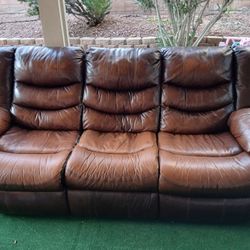 Brown Rustic Couches And Two Stands 