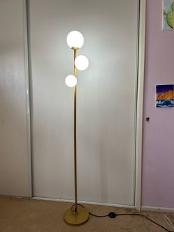 Gold floor lamp with 3 globe lights