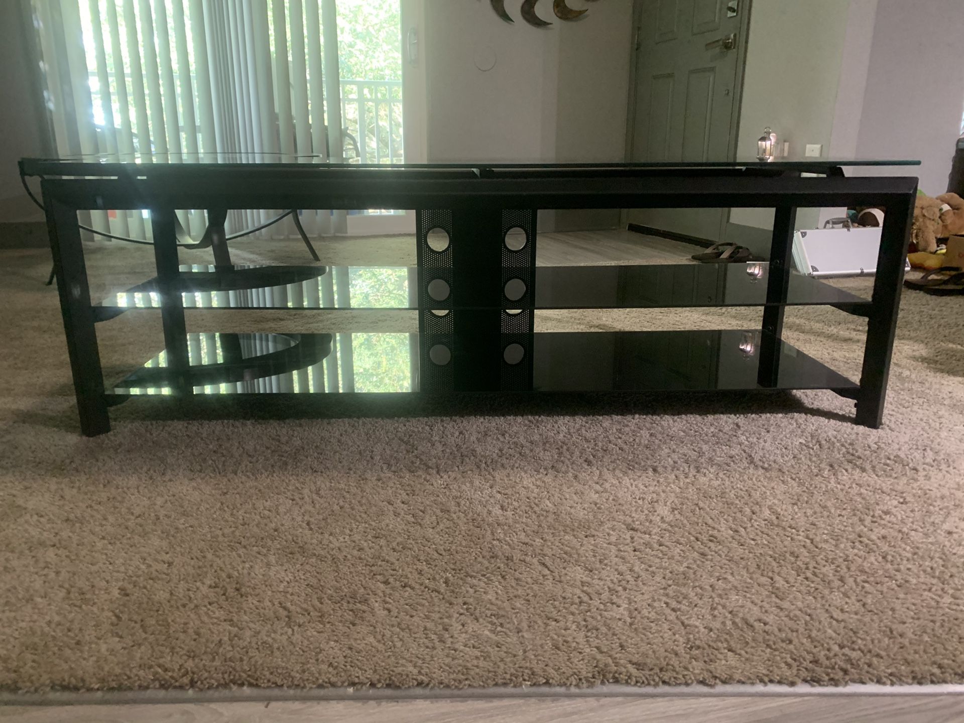 Black TV stand with black tempered glass