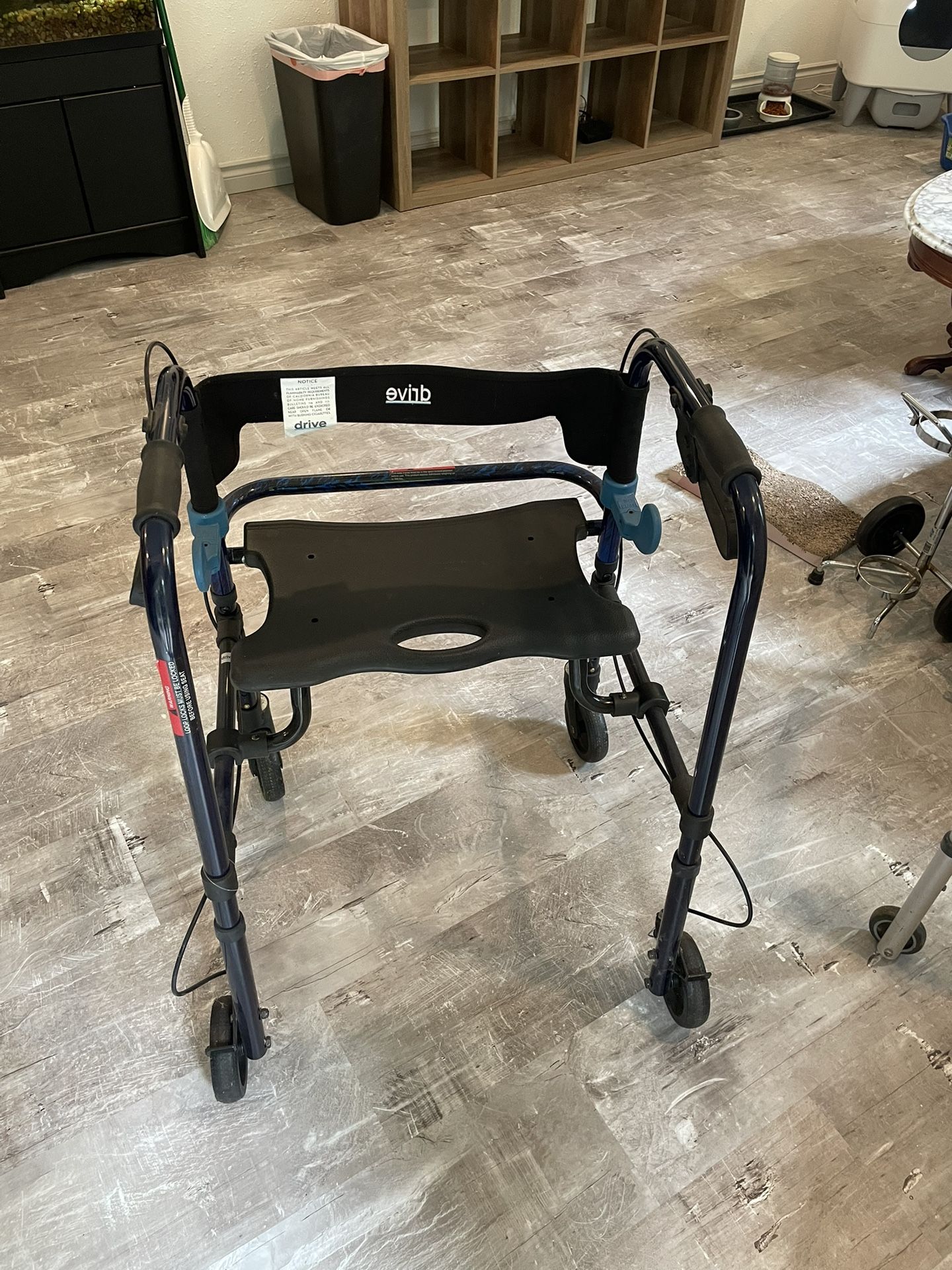 Walker with folding seat 