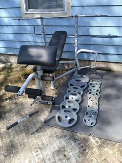 Powerhouse 685 multi functional bench/1Inch weights with barbell.