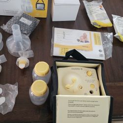 NEW Medela Breast Pump And Accessories 