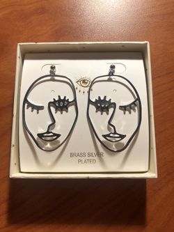 silver face earrings
