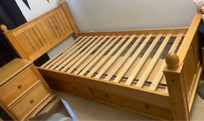 Twin bed frame with storage drawers. Matching nightstand.