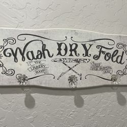 Laundry sign with 3 hanging knobs