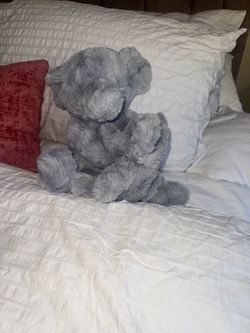 Peluche elegante con baby elefante