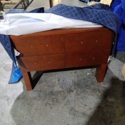  Cabinet And A Round Mirror 