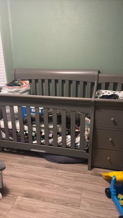Gray baby crib