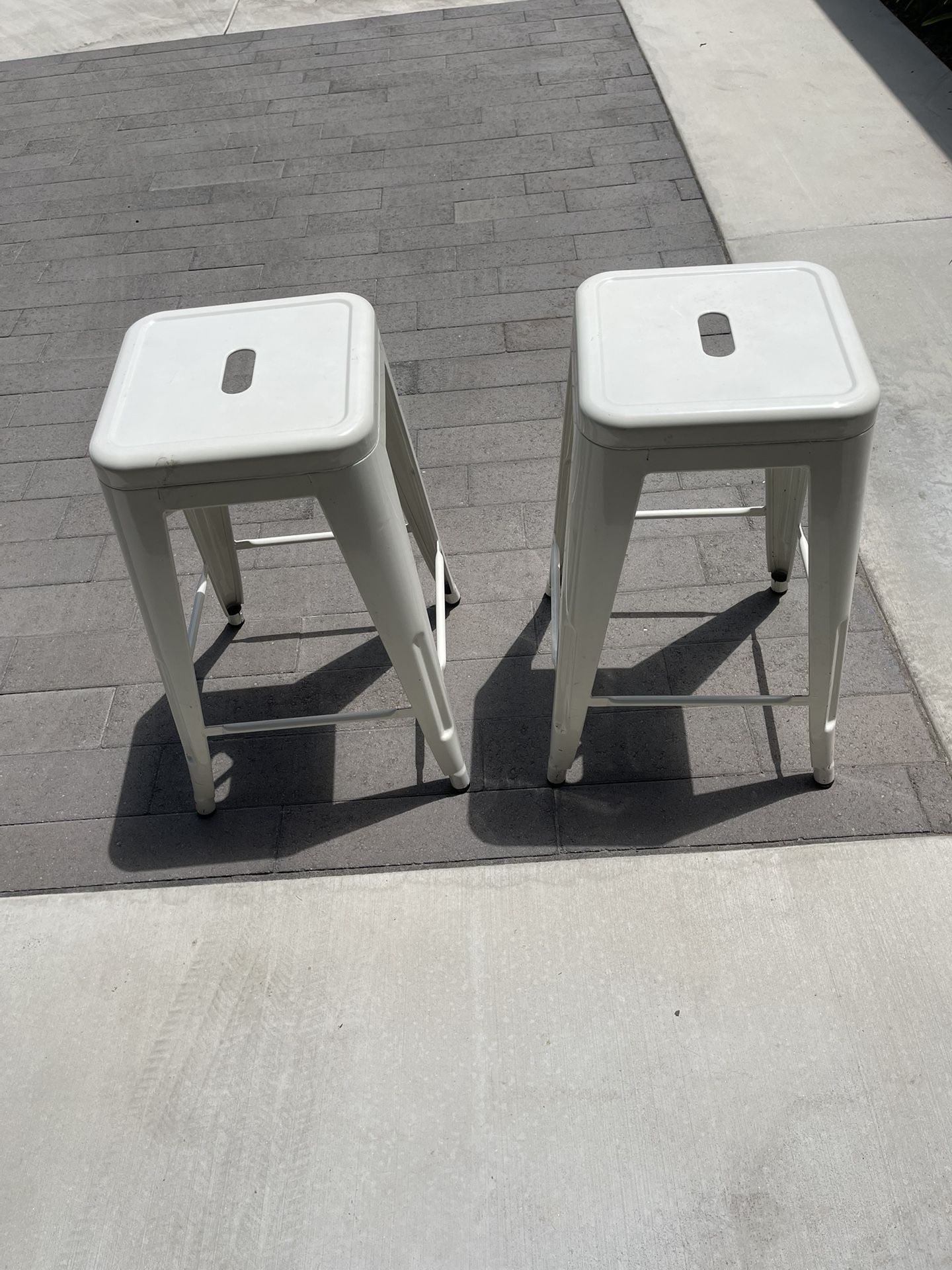 Two metal counter height bar stools