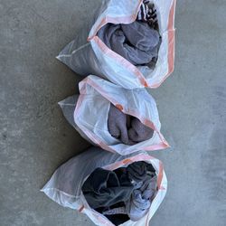 3 Bags Of women’s clothes (size Medium)