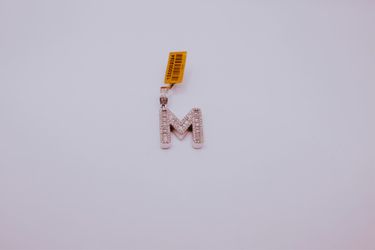 14 karat diamond M pendant