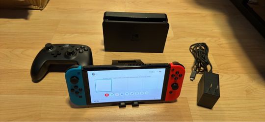 Nintendo switch OLED with docking station, extra controller and charger no trades cash only see my other listings for more gaming stuff