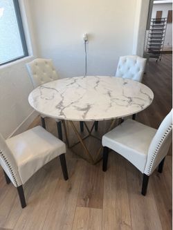 Beautiful stone 51” wide dining table and 4 chairs.