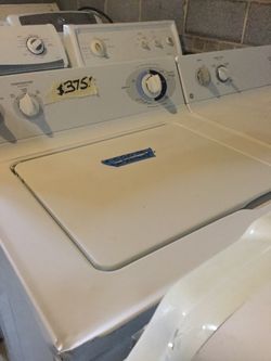 Ge washer and dryer set/ 90 day warranty/ delivery and installation are available/ dent on corner of washer/ washer works great