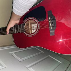 red 12 string Takamine guitar