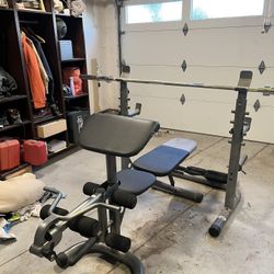 Olympic Bench Press, Leg Extension, Preacher Curl, Olympic Bar, and Weights