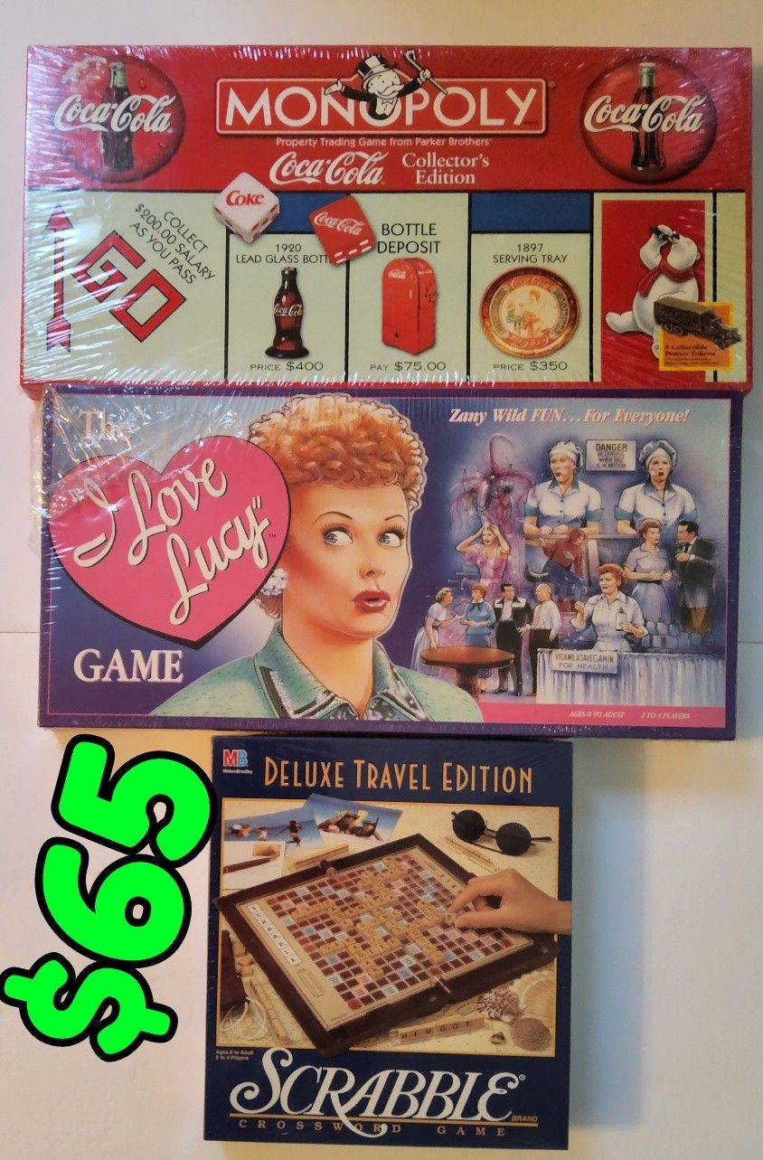 3 Board Games Coca-Cola Monopoly , I Love Lucy game and Scrabble Deluxe Travel Edition $65