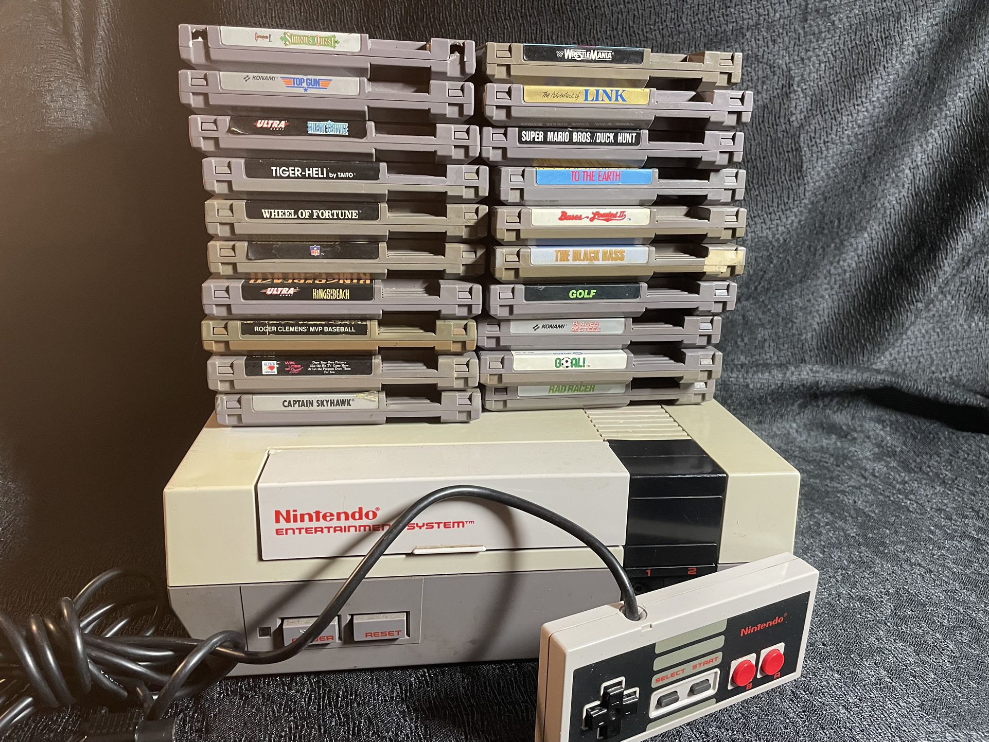 Nintendo nes console w/ all hook ups, controller, and 20 games