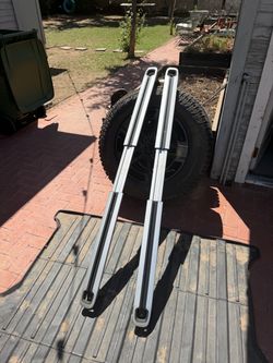 Rivian wheel/tire, cargo bars, camp speaker and more