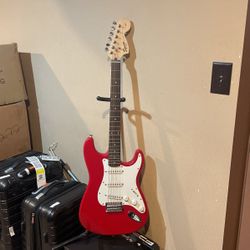 red electric fender guitar